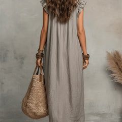 Green Sienna Boho Ruffle Maxi Dress by THE WHITMORE FAMILY, flowing fabric with ruffle details, perfect for casual or summer wear.
