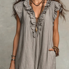 Green Sienna Boho Ruffle Maxi Dress by THE WHITMORE FAMILY, flowing fabric with ruffled details and a relaxed bohemian style.