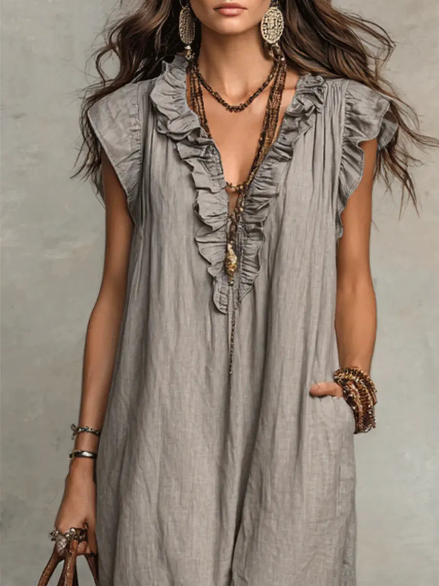 Green Sienna Boho Ruffle Maxi Dress by THE WHITMORE FAMILY, flowing fabric with ruffled details and a relaxed bohemian style.