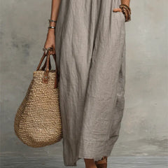 Green Sienna boho ruffle maxi dress by THE WHITMORE FAMILY, flowing fabric with layered ruffles and a relaxed bohemian style.