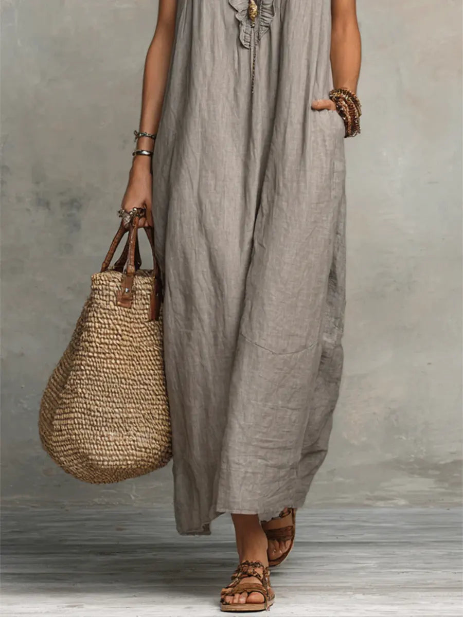 Green Sienna boho ruffle maxi dress by THE WHITMORE FAMILY, flowing fabric with layered ruffles and a relaxed bohemian style.