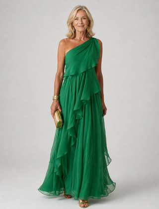 Elegant Victoria maxi dress by The Whitmore Family featuring flowing fabric and a stylish neckline, worn by a model.
