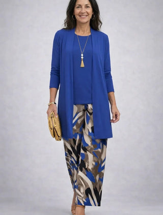 Elegant three-piece trouser set by THE WHITMORE FAMILY featuring stylish tailored pants, a matching blazer, and a coordinating top.
