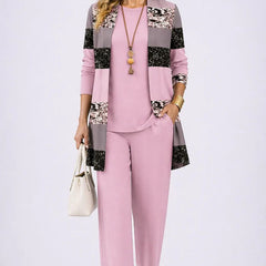 Elegant three-piece trouser set by THE WHITMORE FAMILY featuring tailored trousers, a stylish top, and a coordinating jacket.