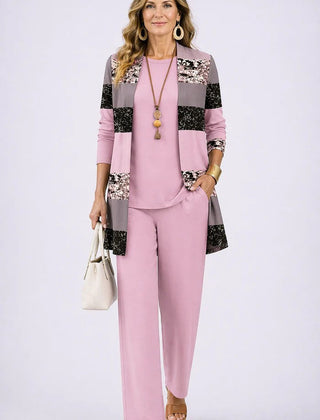 Elegant three-piece trouser set by THE WHITMORE FAMILY featuring tailored trousers, a stylish top, and a coordinating jacket.