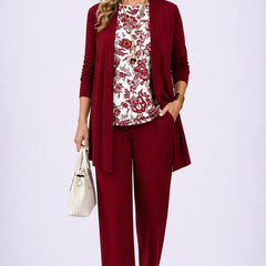 Elegant three-piece trouser set by The Whitmore Family featuring a stylish blouse, tailored trousers, and coordinating blazer.