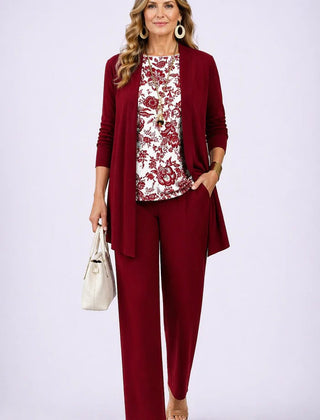 Elegant three-piece trouser set by The Whitmore Family featuring a stylish blouse, tailored trousers, and coordinating blazer.