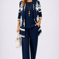 Elegant three-piece trouser set by The Whitmore Family featuring tailored pants, a stylish top, and a coordinating jacket.