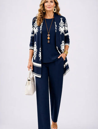 Elegant three-piece trouser set by The Whitmore Family featuring tailored pants, a stylish top, and a coordinating jacket.