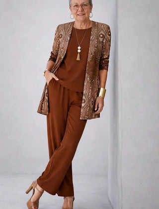 Elegant three-piece trouser set by The Whitmore Family featuring a stylish blouse, tailored trousers, and matching blazer.