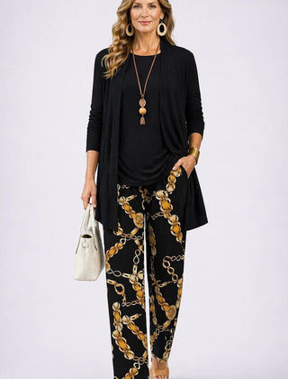 Elegant three-piece trouser set by The Whitmore Family featuring tailored details and sophisticated style.