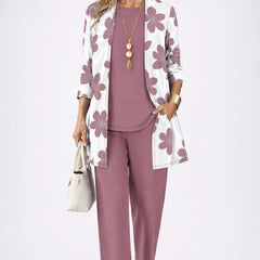 Elegant three-piece trouser set by THE WHITMORE FAMILY featuring a tailored blazer, matching trousers, and a stylish top.