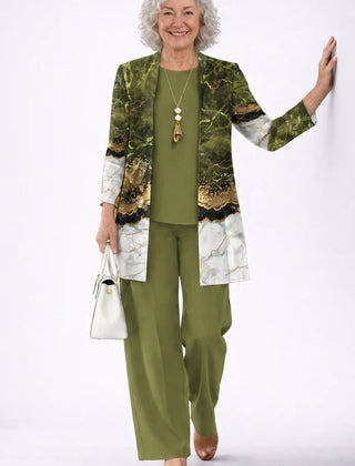 Elegant three-piece trouser set by The Whitmore Family featuring tailored pants, a matching blazer, and a stylish top.