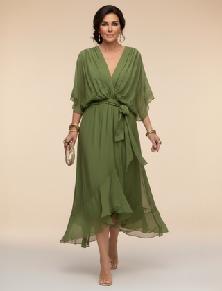 Green Sarah Sandra chiffon V-neck dress by THE WHITMORE FAMILY, lightweight and elegant with flowing fabric and a flattering V-neck design.