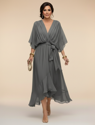 Green Sandra chiffon V-neck dress by THE WHITMORE FAMILY, featuring a flowy fit and elegant design.