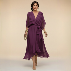 Green Sandra chiffon V-neck dress by THE WHITMORE FAMILY, featuring a flowy design and elegant style in XS size.