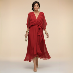 Green Sarah Sandra chiffon V-neck dress by THE WHITMORE FAMILY, lightweight fabric, fitted waist, and flowing skirt, XS size.