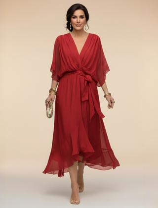 Green Sarah Sandra chiffon V-neck dress by THE WHITMORE FAMILY, lightweight fabric, fitted waist, and flowing skirt, XS size.