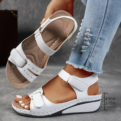 Grey Janet orthopedic comfort flex sandals by THE WHITMORE FAMILY, featuring supportive straps and cushioned soles for all-day wear.