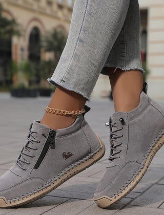 Grey Tara™ ergonomic support sneakers by THE WHITMORE FAMILY with cushioned soles and breathable mesh upper.