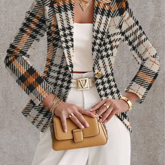 Ghislaine houndstooth blazer by The Whitmore Family, beige and black tailored jacket with classic pattern on model.