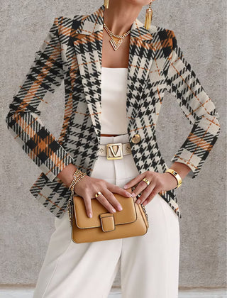 Ghislaine houndstooth blazer by The Whitmore Family, beige and black tailored jacket with classic pattern on model.