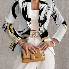 Noemine abstract brushstroke blazer from THE WHITMORE FAMILY, shown in a stylish jacket with a bold brushstroke pattern.
