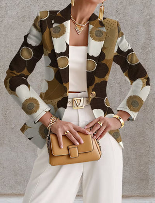 Daisy print blazer by THE WHITMORE FAMILY, featuring tailored fit and vibrant flower pattern, shown on a model.