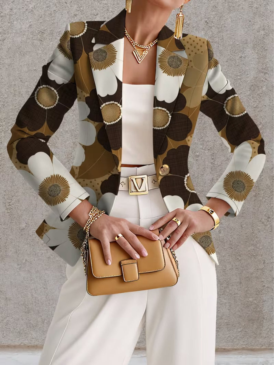 Daisy print blazer by THE WHITMORE FAMILY, featuring tailored fit and vibrant flower pattern, shown on a model.