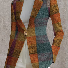 A woman wearing the Amandine Autumn Plaid Blazer by The Whitmore Family, showcasing the stylish plaid pattern and tailored fit.