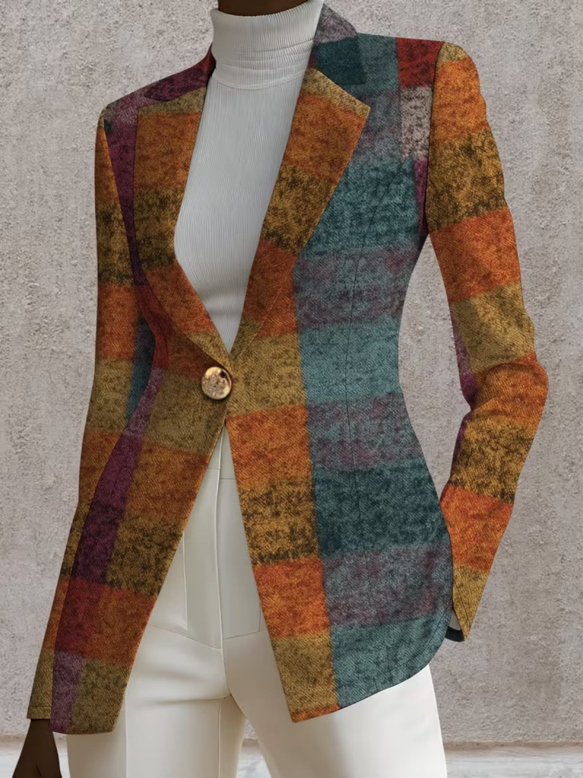 A woman wearing the Amandine Autumn Plaid Blazer by The Whitmore Family, showcasing the stylish plaid pattern and tailored fit.