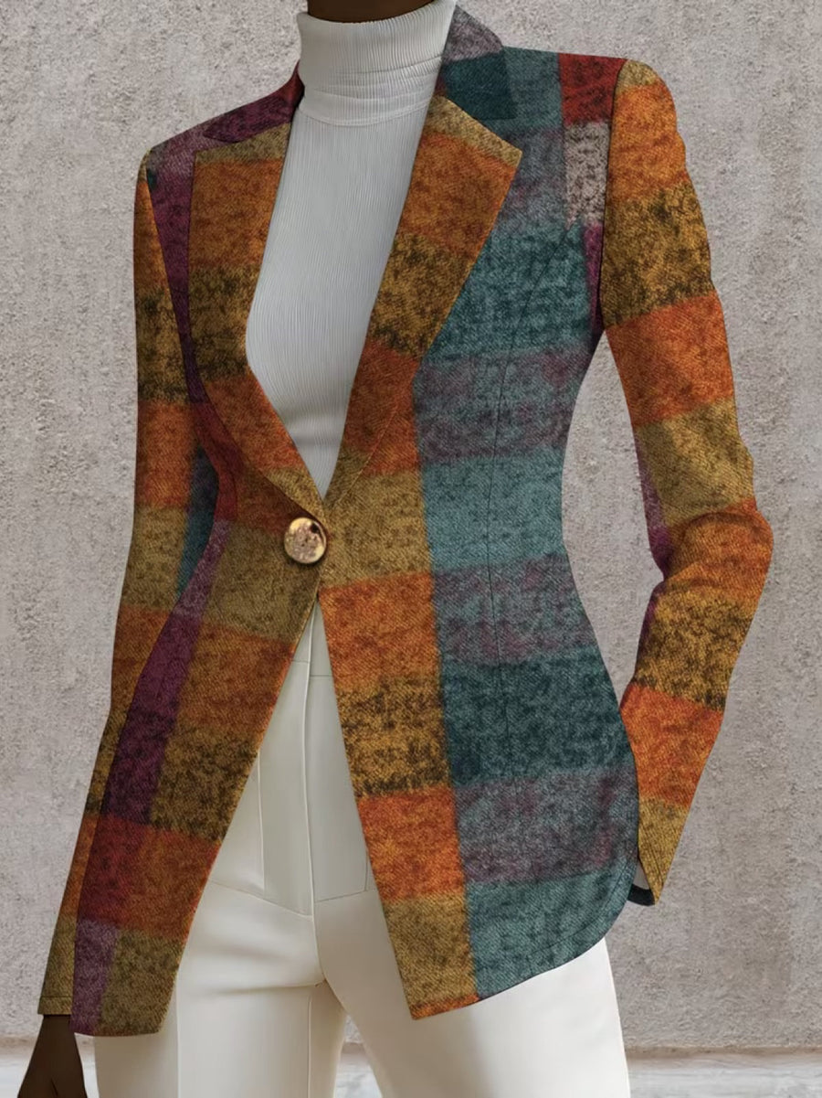 A woman wearing the Amandine Autumn Plaid Blazer by The Whitmore Family, showcasing the stylish plaid pattern and tailored fit.