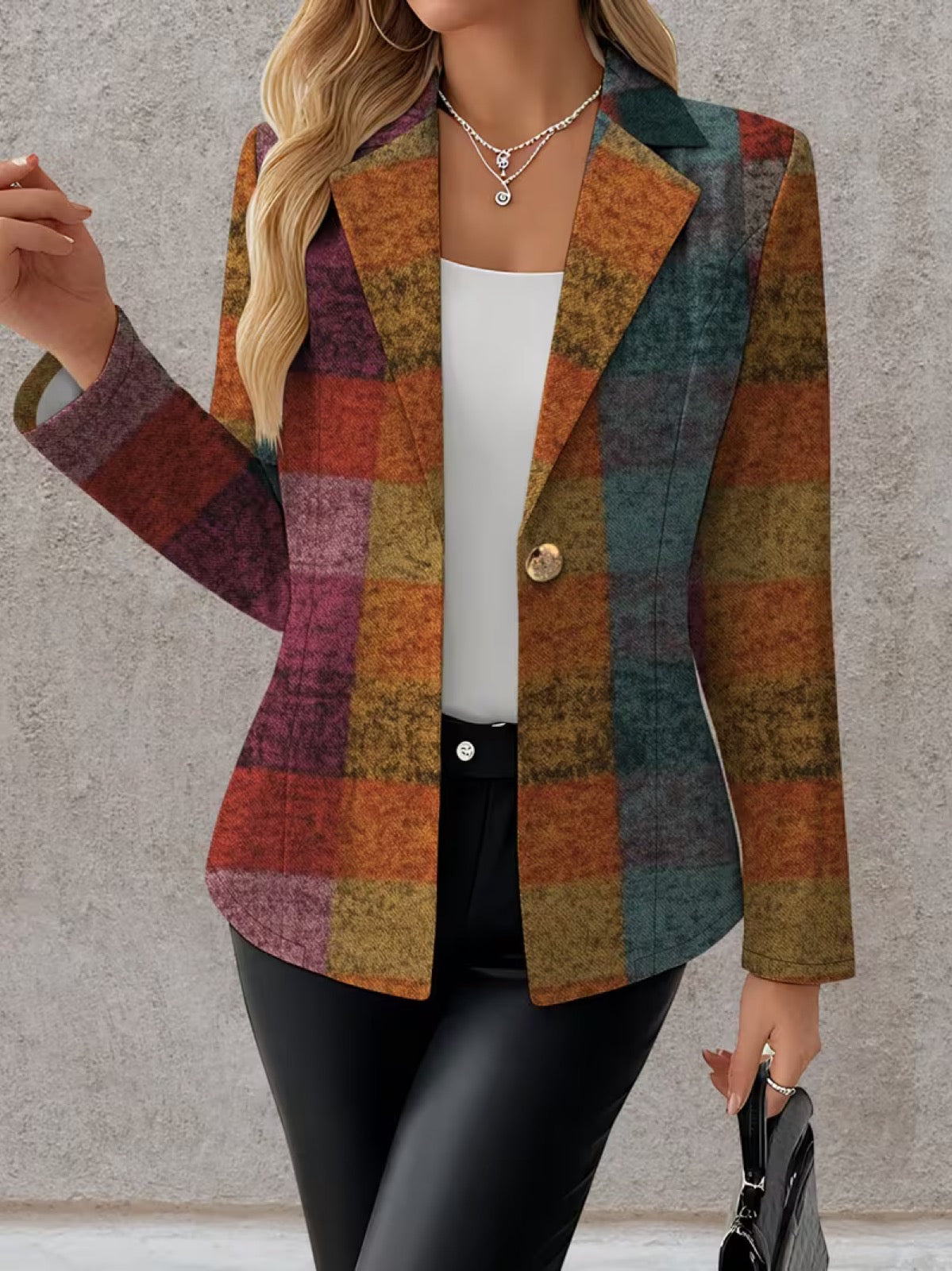 A woman wears the Amandine Autumn Plaid Blazer from The Whitmore Family, featuring classic plaid pattern and tailored fit.