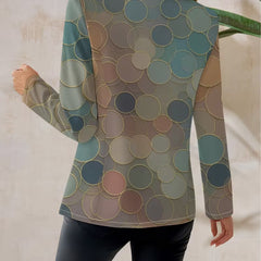The Whitmore Family Capucine Dot Mosaic Blazer showcasing a stylish, patterned jacket with a tailored fit and vibrant mosaic design.