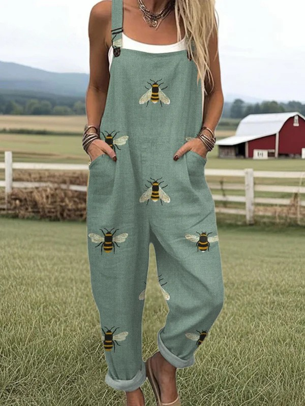 THE WHITMORE FAMILY Garden Whimsy Jumpsuit from the Jumpsuit Collection, featuring a colorful floral pattern and casual fit.