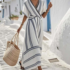 White Lily Santorini summer dress by THE WHITMORE FAMILY, sleeveless, flowy, lightweight fabric perfect for warm weather.