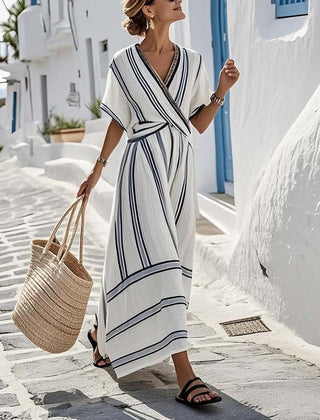 White Lily Santorini summer dress by THE WHITMORE FAMILY, sleeveless, flowy, lightweight fabric perfect for warm weather.
