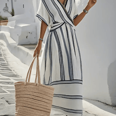White Lily Santorini summer dress by THE WHITMORE FAMILY, lightweight and flowy linen dress with a relaxed fit and floral design.