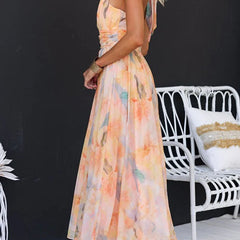 Peach Abigail maxi dress with colorful print by THE WHITMORE FAMILY, flowing fabric and elegant design for casual or formal wear.