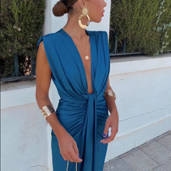 Blue rose-colored elegant pleated dress by THE WHITMORE FAMILY, perfect for wedding guests, stylish and sophisticated.