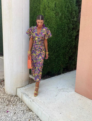 Purple Loren vibrant midi dress with puff sleeves, stylish and elegant for wedding guest attire, by THE WHITMORE FAMILY.