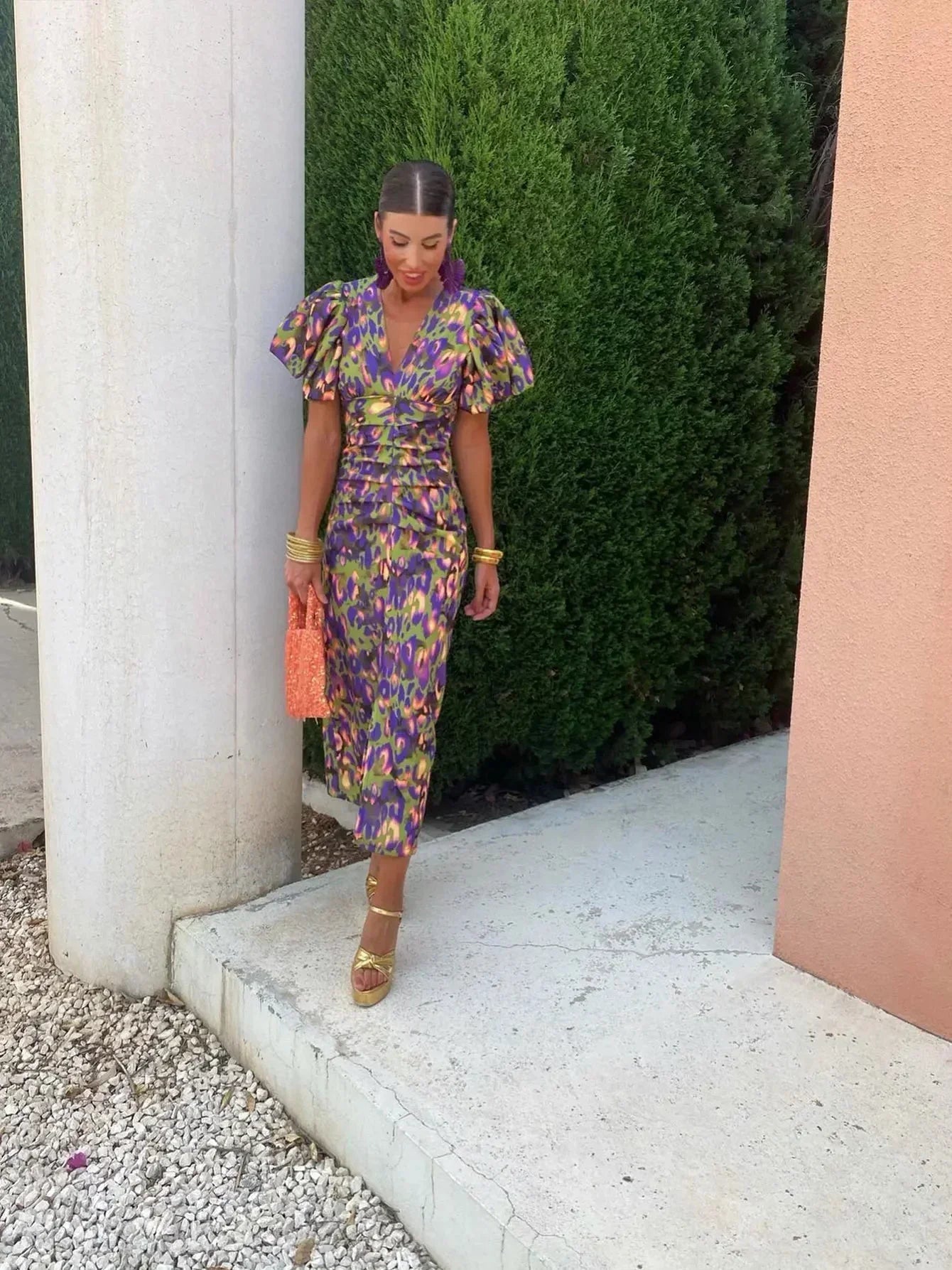 Purple Loren vibrant midi dress with puff sleeves, stylish and elegant for wedding guest attire, by THE WHITMORE FAMILY.