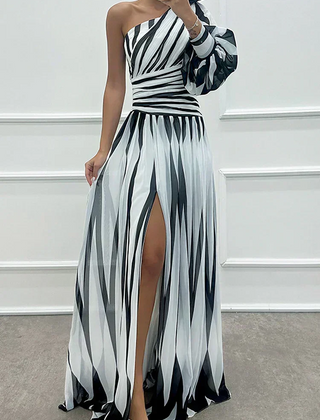 Elegant Shiloh striped maxi dress by The Whitmore Family, featuring a flowing silhouette and stylish pattern for wedding guest attire.