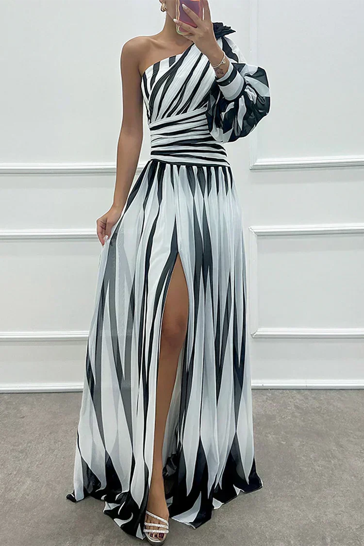 Elegant Shiloh striped maxi dress by The Whitmore Family, featuring a flowing silhouette and stylish pattern for wedding guest attire.