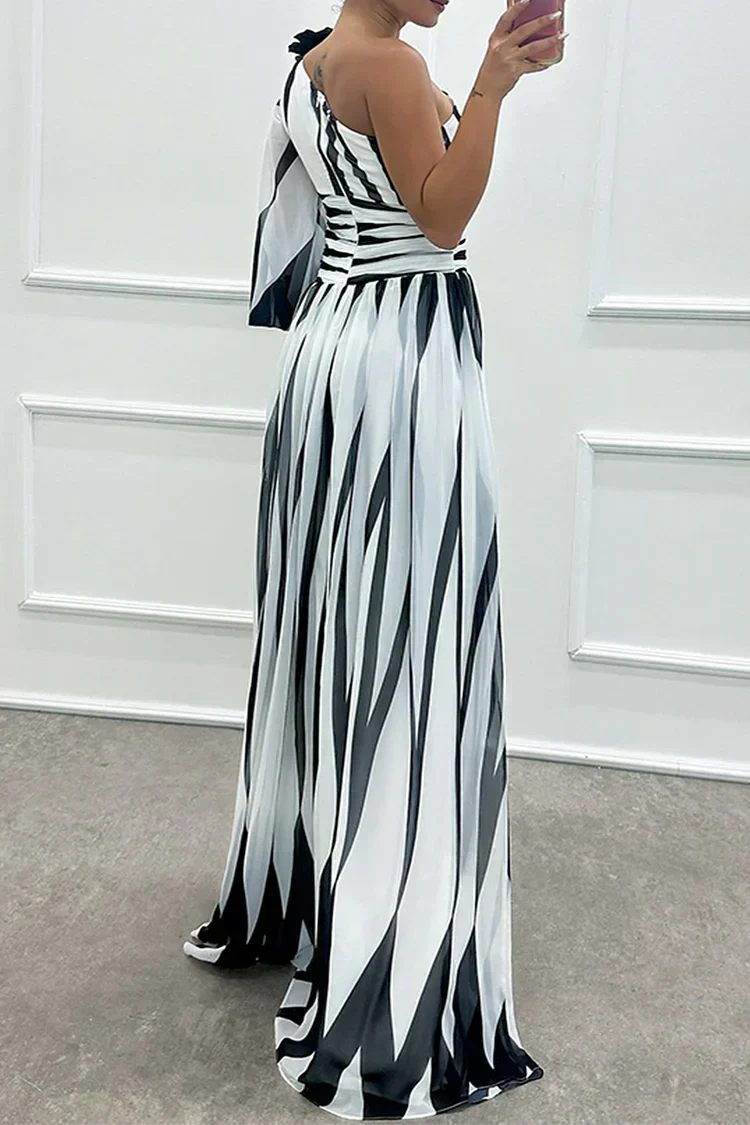 Elegant Shiloh striped maxi dress by The Whitmore Family, perfect for wedding guests, featuring a flowing silhouette and stylish design.