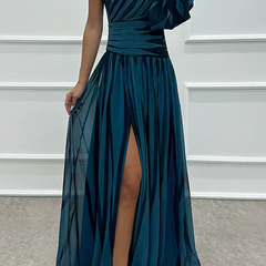Elegant Shiloh striped maxi dress by THE WHITMORE FAMILY, featuring a flowing design suitable for wedding guest attire.