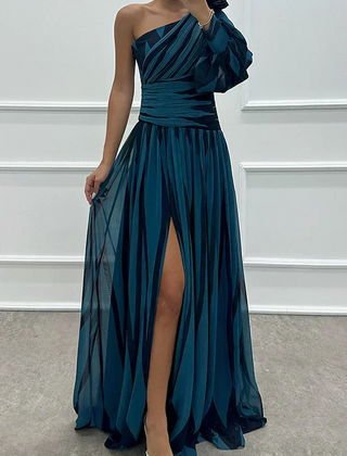 Elegant Shiloh striped maxi dress by THE WHITMORE FAMILY, featuring a flowing design suitable for wedding guest attire.