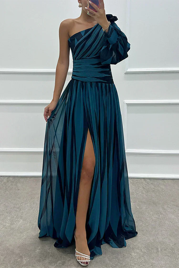 Elegant Shiloh striped maxi dress by THE WHITMORE FAMILY, featuring a flowing design suitable for wedding guest attire.