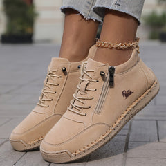 Khaki Nola™ ergonomic support sneakers by THE WHITMORE FAMILY, showcasing cushioned soles and breathable design.