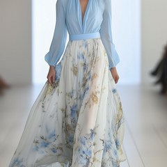 Light blue Audrey maxi dress by THE WHITMORE FAMILY featuring a vibrant floral print, flowing fabric, and elegant design.